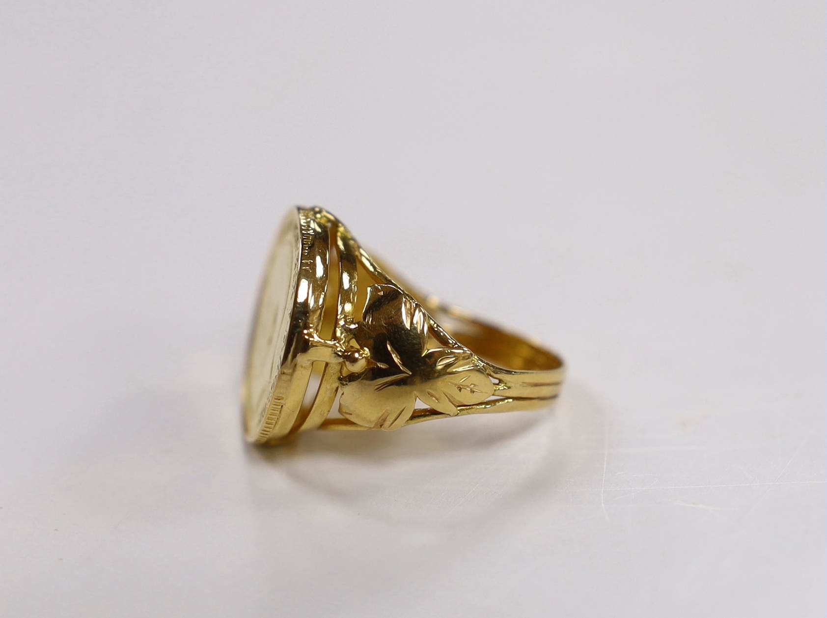 A 1912 gold half sovereign, now in yellow metal ring mount, size P, gross 9.4 grams.